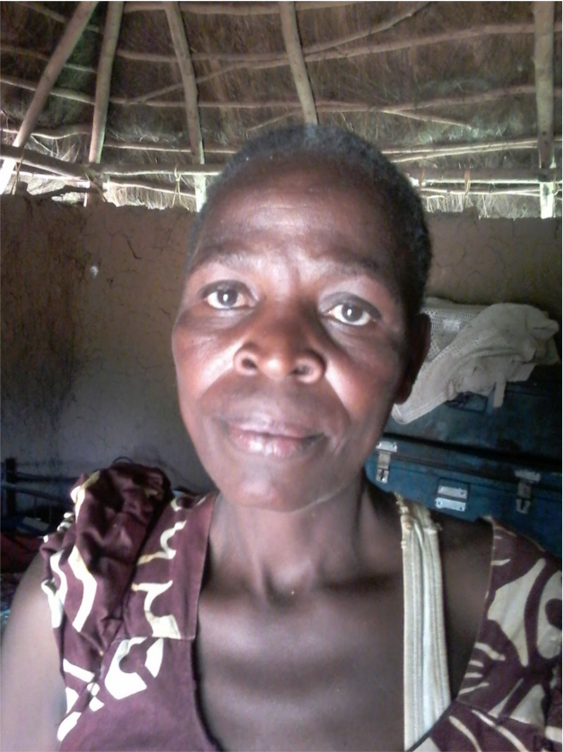 Foto de uma mulher. Ela é recipiente das doações da GiveDirectly